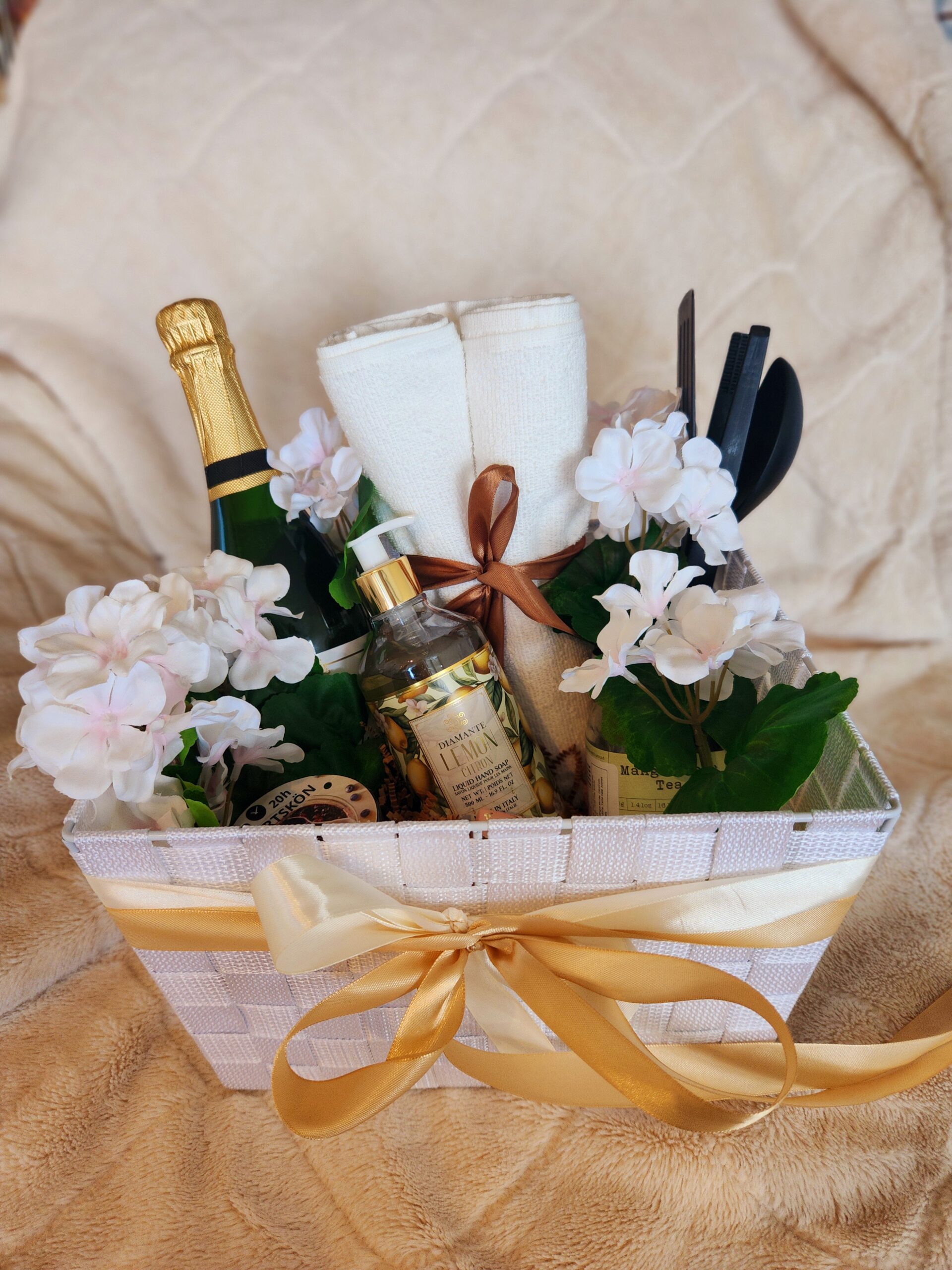 A housewarming gift basket is a thoughtful collection of items meant to welcome someone into their new home.